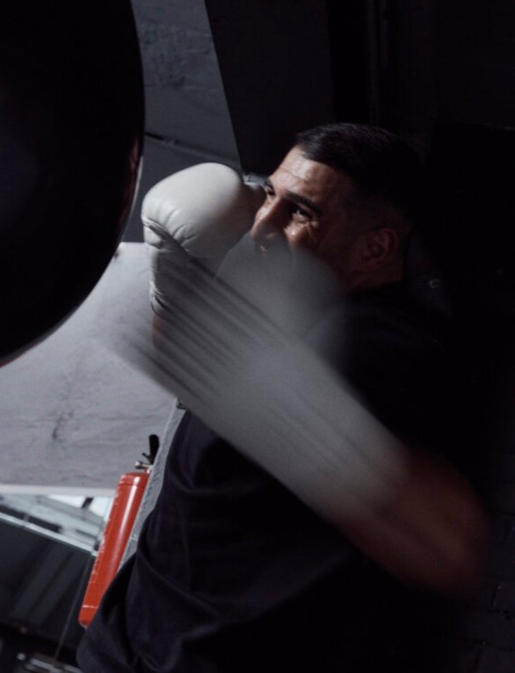 Agit Kabayel training on the heavy bag